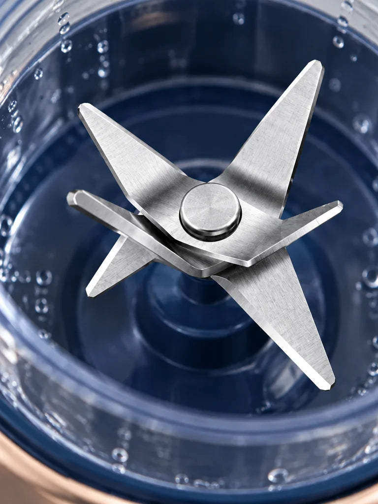 An extreme close photograph of the exact six-blade metal assembly inside the clear BlendGo Mini vess